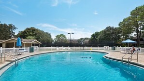 A clear blue swimming pool with a white fence, lounge chairs, and umbrellas. - Seascape Villa 35D*Quiet Villa*Beach Access*Pools* (Miramar Beach)