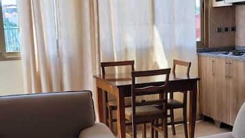 Superior Apartment | Living area | Flat-screen TV