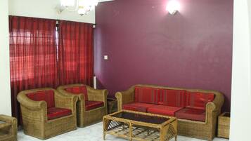 Business Suite | Living area | 21-inch LED TV with satellite channels