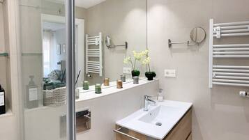 Shower, hair dryer, towels, soap