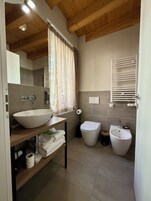 Superior Townhome | Bathroom | Shower, rainfall showerhead, hair dryer, bathrobes