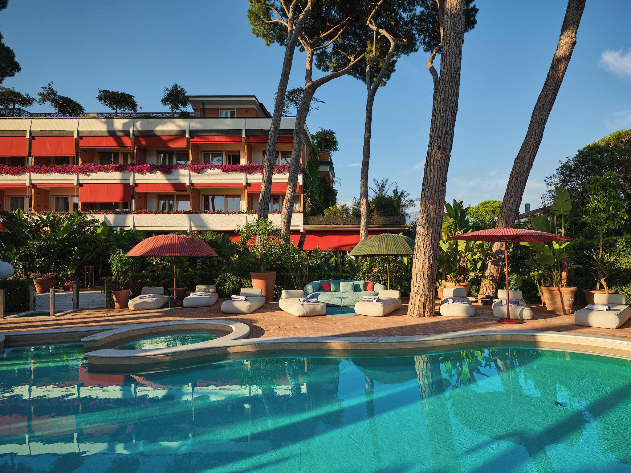 Seasonal outdoor pool, open 8:00 AM to 8:30 PM, pool umbrellas
