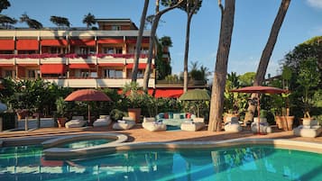 Seasonal outdoor pool, open 8:00 AM to 8:30 PM, pool umbrellas