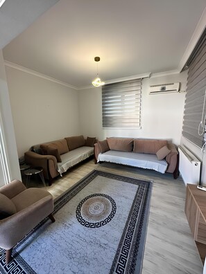 Family Apartment | Living area | 55-inch Smart TV with satellite channels - City Center Apartments (Trabzon)