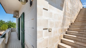 A stone staircase leading up to a building with a tiled floor and green shutters. - 3635 Villa Dolce - App 2 by Barbarhouse (Ostuni)