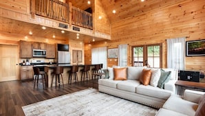 A spacious cabin interior with a kitchen, dining area, and living room. - Mountain Views/Near DwTn Gat/New (Gatlinburg)