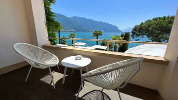 Junior Suite Signature, Balcony & Lake View | Premium bedding, minibar, in-room safe, blackout drapes