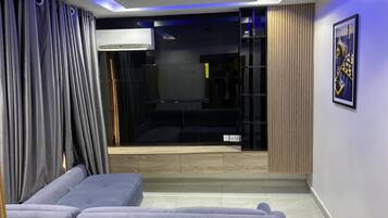 Business Suite | Living area | 38-inch plasma TV with satellite channels