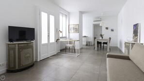 Apartment (1 Bedroom) | Living area | 55-inch Smart TV with cable channels