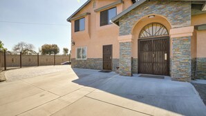 A two-story house with a stone facade, a large front door, and a driveway. - 3 Mi to Sofi Stadium! Hidden Gem in Hawthorne (Hawthorne)