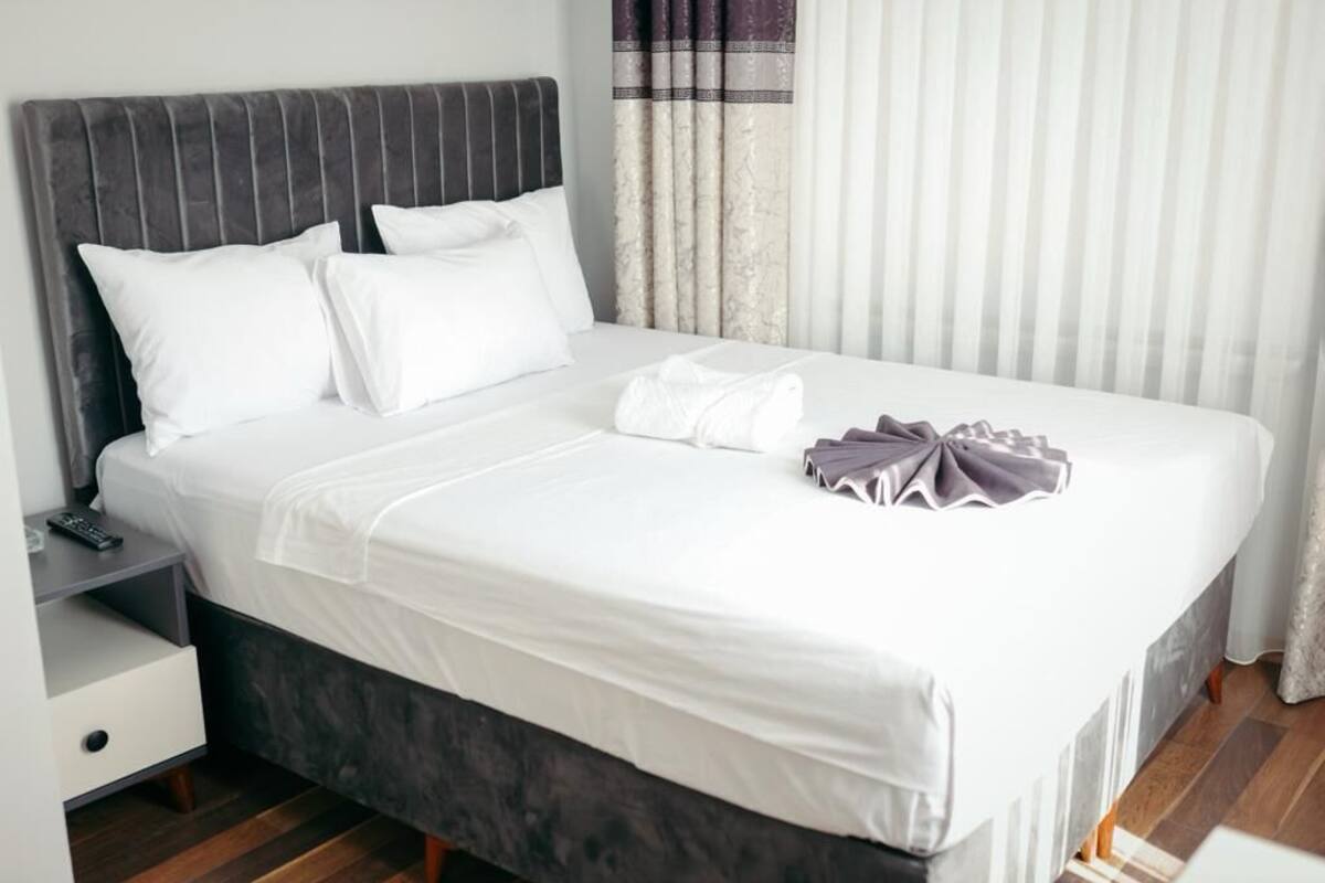 Desk, laptop workspace, bed sheets