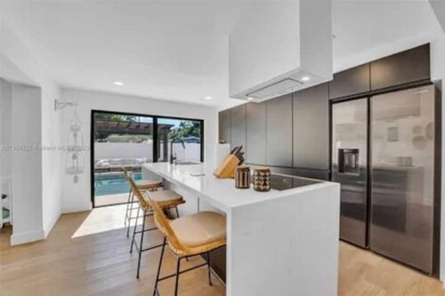 Modern 4BR Pool Home Minutes from Beach & Stadium