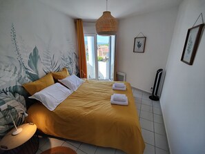 1 bedroom, desk, iron/ironing board, travel crib