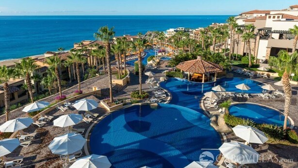 A resort with multiple swimming pools, palm trees, and a view of the ocean. - Studio Priv Balcony PBonito Sunset Beach
 (Paraiso Escondido)