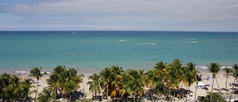 On the beach, sun loungers, beach towels