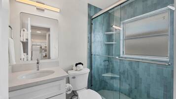 Shower, hair dryer, towels, soap