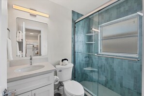 Shower, hair dryer, towels, soap