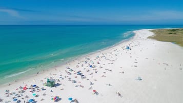 On the beach, sun loungers, beach towels