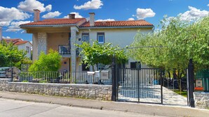 A two-story building with a red-tiled roof, stone facade, and balconies. - Apartment 2265/75351 (Istria - Pula), 500m from the beach (Pula)