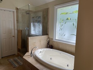 Jetted tub, hair dryer, towels, soap