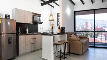 Fridge, microwave, stovetop, coffee/tea maker