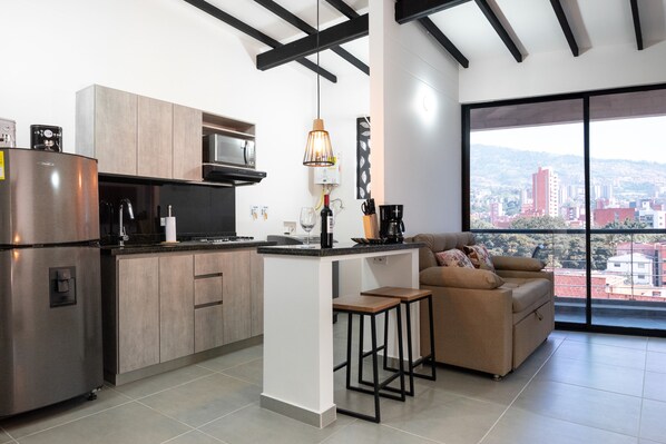 Fridge, microwave, stovetop, coffee/tea maker