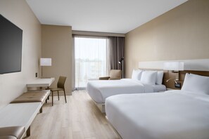 A hotel room with two beds, a desk, a chair, and a large window with curtains. - AC Hotel Jacksonville St Johns Town Center (Jacksonville)