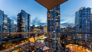 A high-rise building with multiple floors, large windows, and a cityscape view.