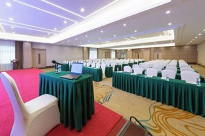 A conference room with rows of tables, chairs, and a laptop on a table. - Forstar Hotel (Chengdu Renmin North Road) (Chengdu)