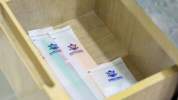 A wooden box with three packages inside.