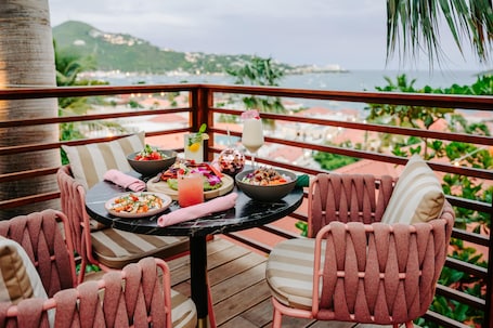 Outdoor dining. The Pink Palm Hotel - Queen Room- USVI