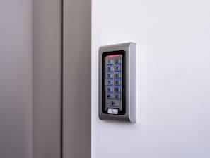A keypad lock on a door.