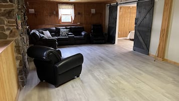 Panoramic Duplex | Living area | 65-inch flat-screen TV with digital channels