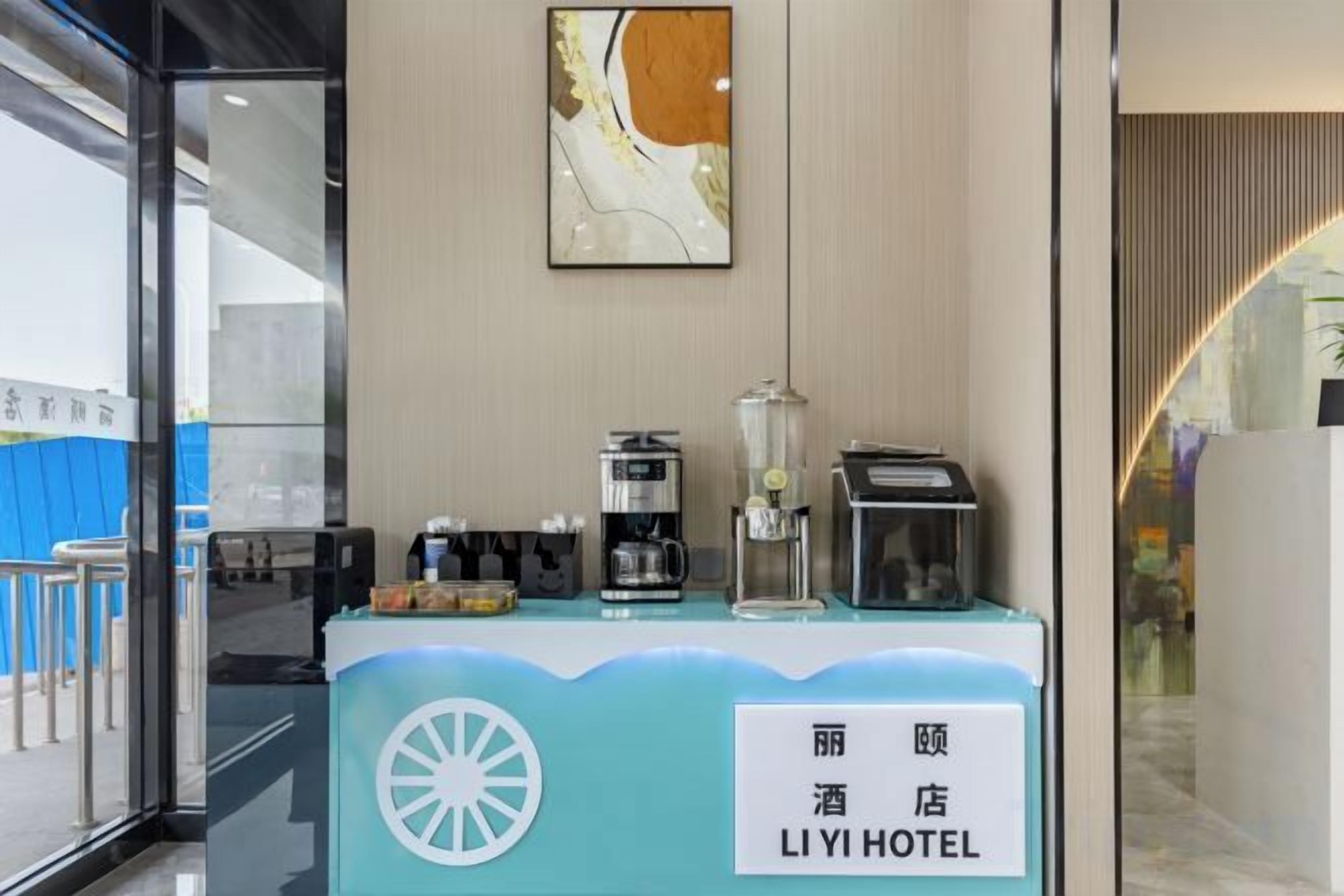 A hotel reception desk with a sign reading 'LIYI HOTEL' and a logo.