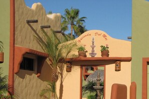 A building with a sign reading "Hacienda Del Mar".