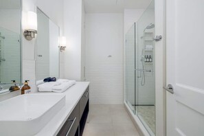 Shower, hair dryer, towels, soap
