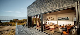 Dune Cabin - The Dune Cabin is well-appointed and uniquely designed and comfortably sleeps 6 guests. Private bedroom with queen bed, open loft with twin beds, and dinette that converts to a full size bed