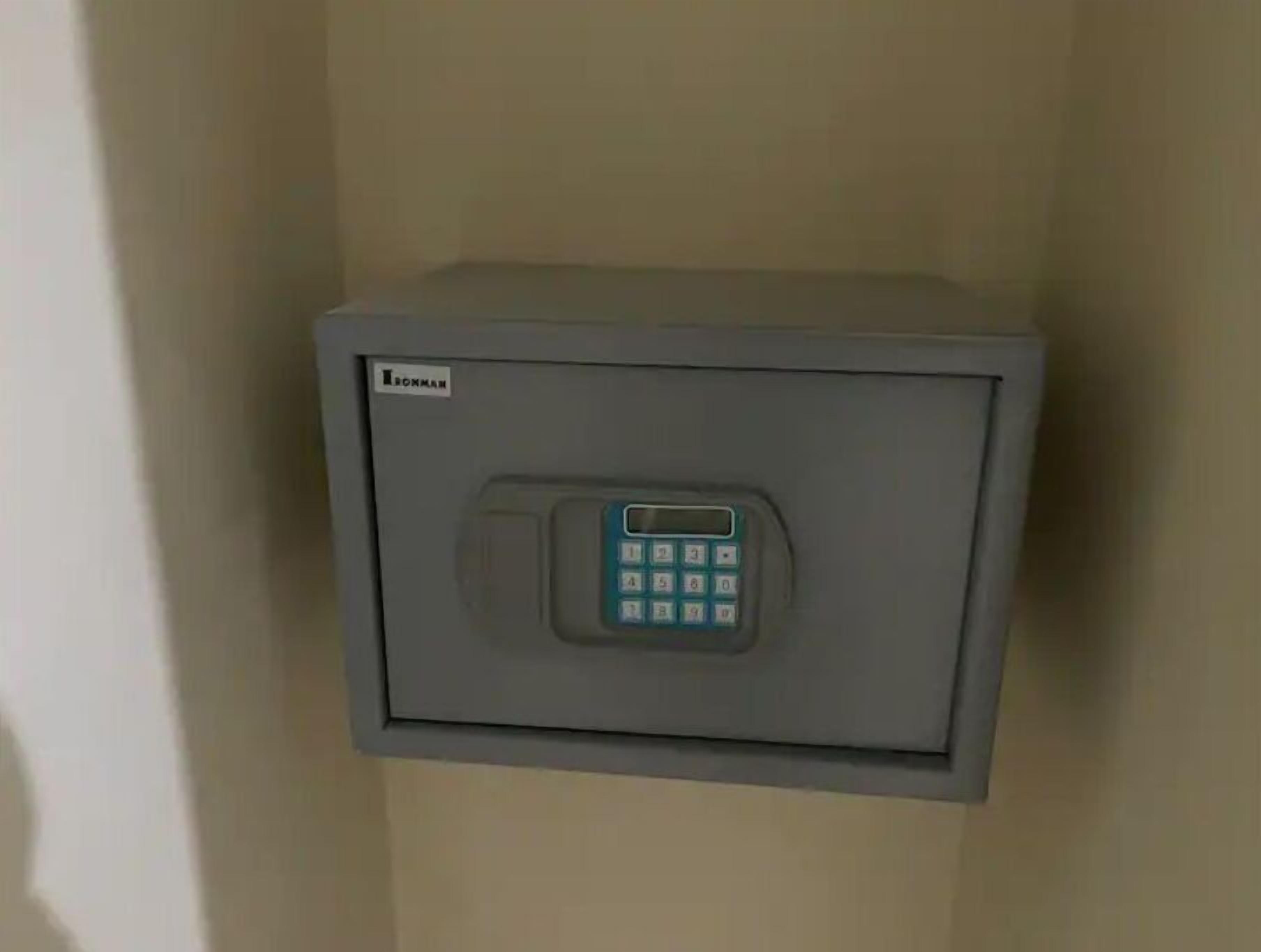 A grey safe with a keypad, labeled 'BOXMAN'.