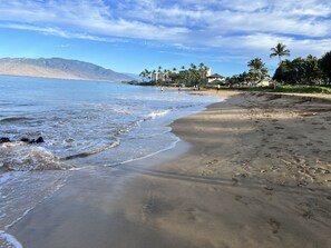 A beach with clear skies, calm waves, and footprints in the sand. - MauiVista book NOW for whale season!
 Relax-Work-Play in this tropical getaway! (Kihei)