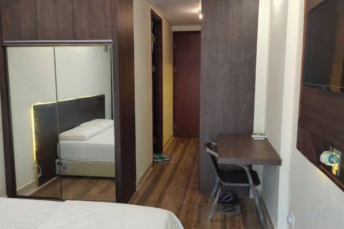 Desk, blackout curtains, bed sheets