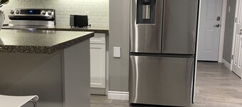 Brand new spacious apartment with private yard/ patio