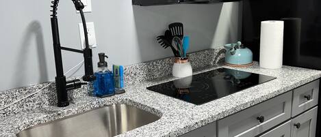 Fridge, microwave, stovetop, coffee/tea maker