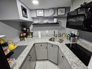 Fridge, microwave, stovetop, coffee/tea maker