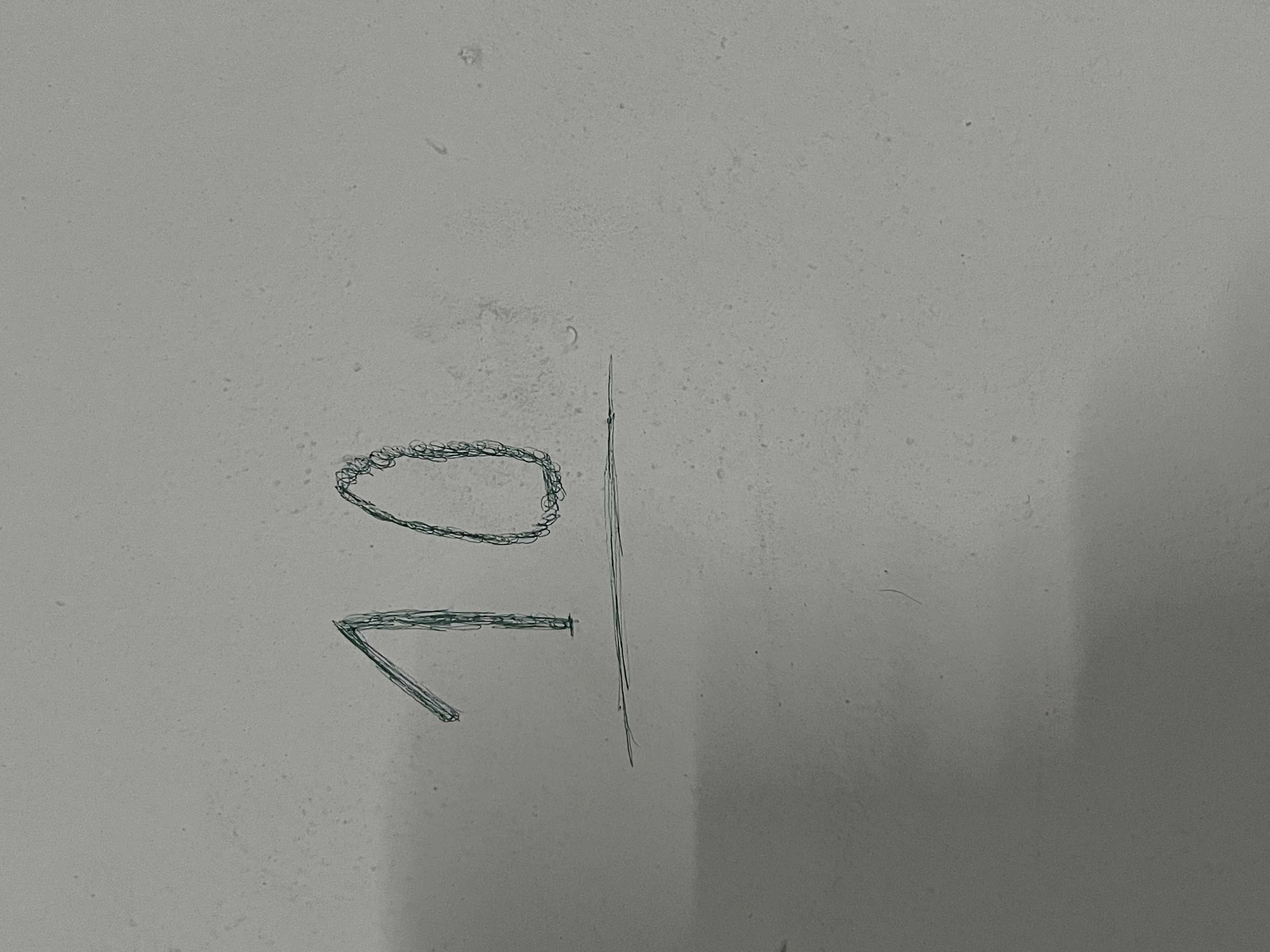 A hand-drawn sketch of a simple geometric shape, possibly a circle or oval, and a line.