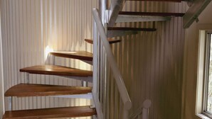 A spiral staircase with wooden steps and white railings. - Seaspray 8 - Stone Real Estate Yamba (Yamba)