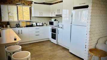 Standard Apartment, Canal View | Private kitchen | Full-sized fridge, microwave, oven, stovetop