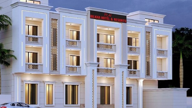 A modern hotel with multiple balconies, a prominent entrance, and a sign indicating it is R.G Bilkha Hotel & Resorts. - R G Bilkha Hotel And Resorts (Alwar)