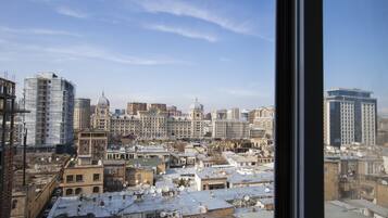 A cityscape with various buildings, including a mix of modern and historical architecture.