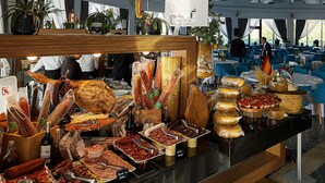 A buffet area with various food items and a modern interior design. - Lebada Luxury Resort & Spa (Crisan)