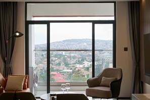 Superior Apartment, 3 Bedrooms, City View | Living area | 142-cm Smart TV with digital channels